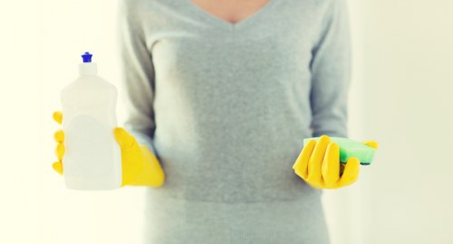 Close-up of microfiber couch being cleaned