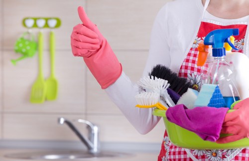 Cleaner vacuuming a modern home interior during house cleaning