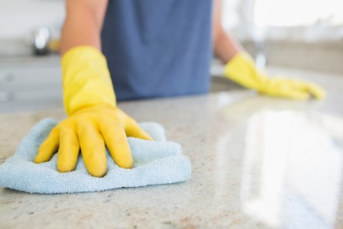 Clean kitchen surfaces as part of domestic cleaning